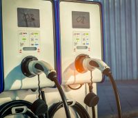 Electric car charging station for charge EV battery. Plug for vehicle with electric and hybrid engine. EV charger. Clean energy. Charging point for EV car. Green power . Future transport technology.